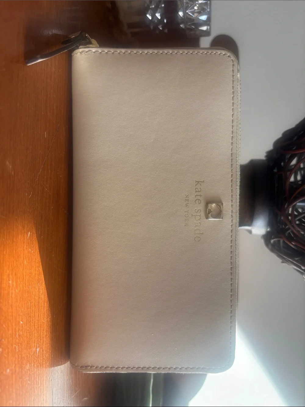 kate spade cream zip wallet with gold logo